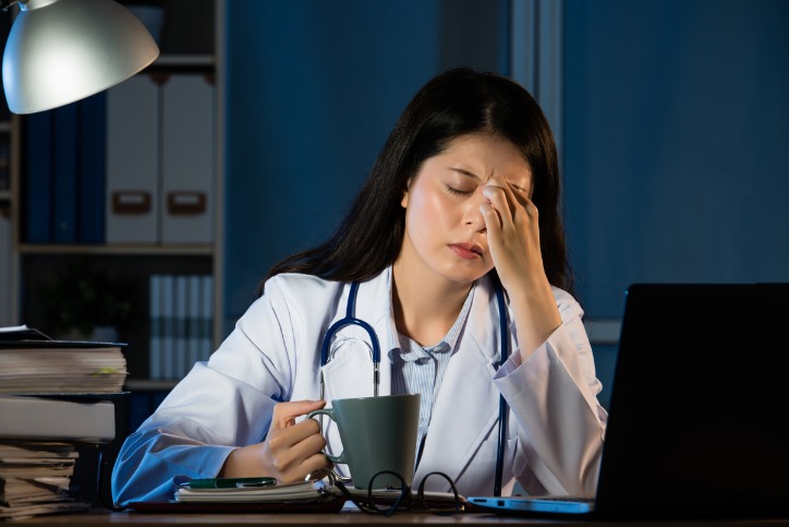 A female doctor over worked and drained