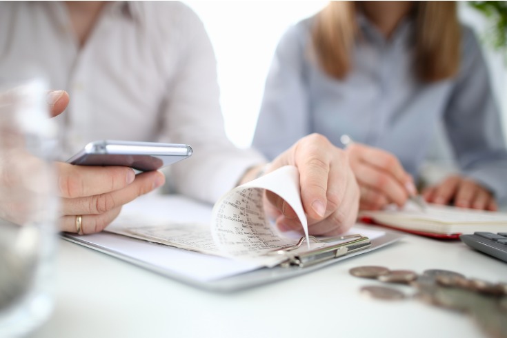 employer reviewing finance with new employee in the workplace