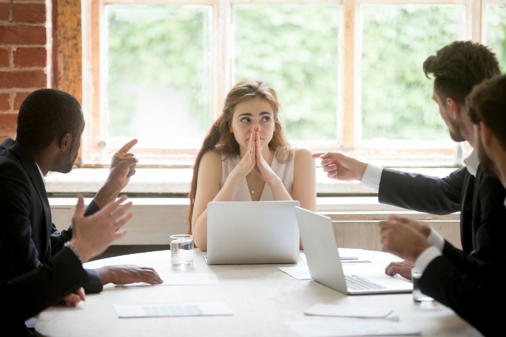 Female office worker stuck in a toxic work environment