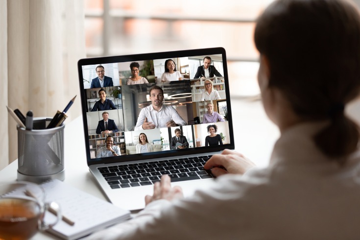 Female manager holding online conference with her team to check in on their mental health 