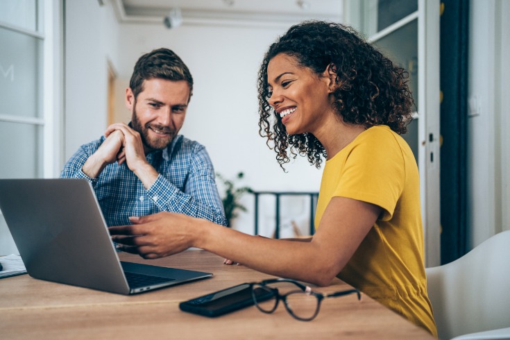 Woman providing outplacement services to an ex employee through a one-on-one meeting.